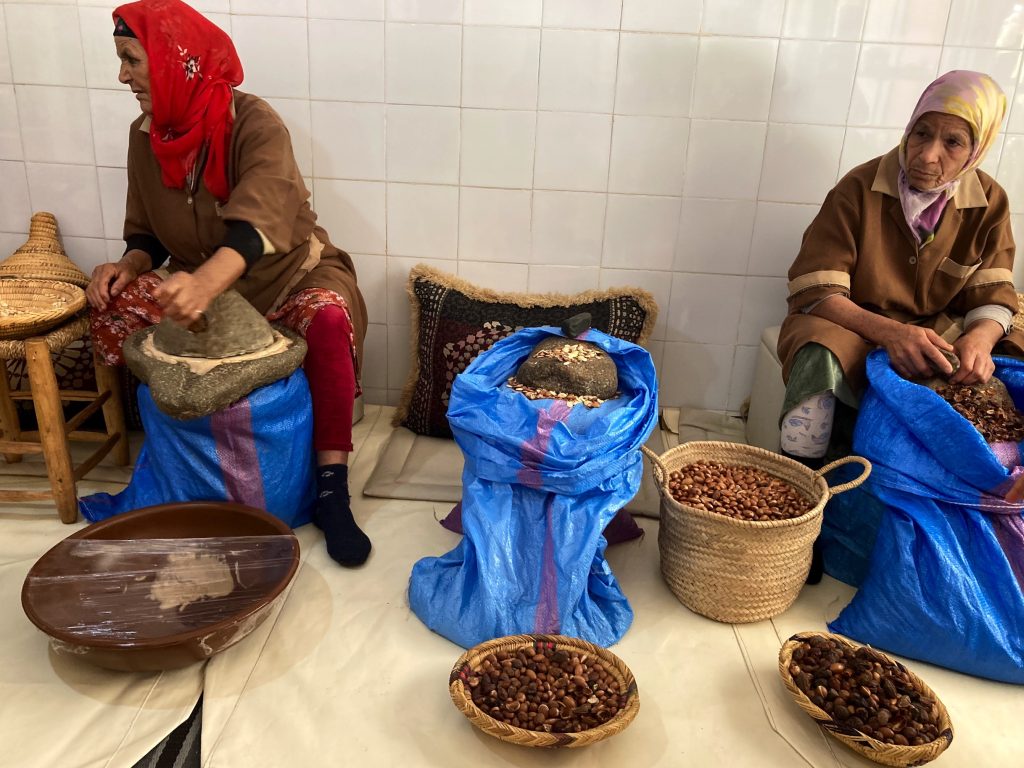 During a day trip from  Marrakesh visit a workshop and watch women making argan oil