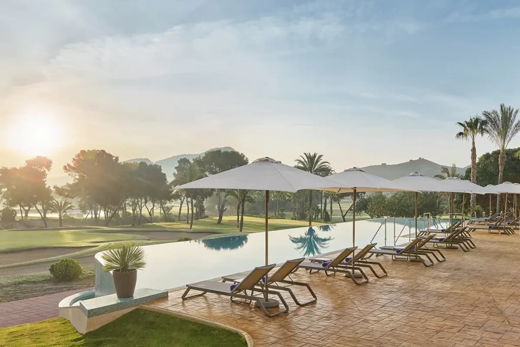 Pool area with sun loungers at Grand Hyatt La Manga